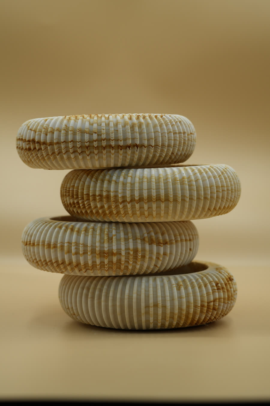 Four ribbed Heartwood bowls stacked on each other